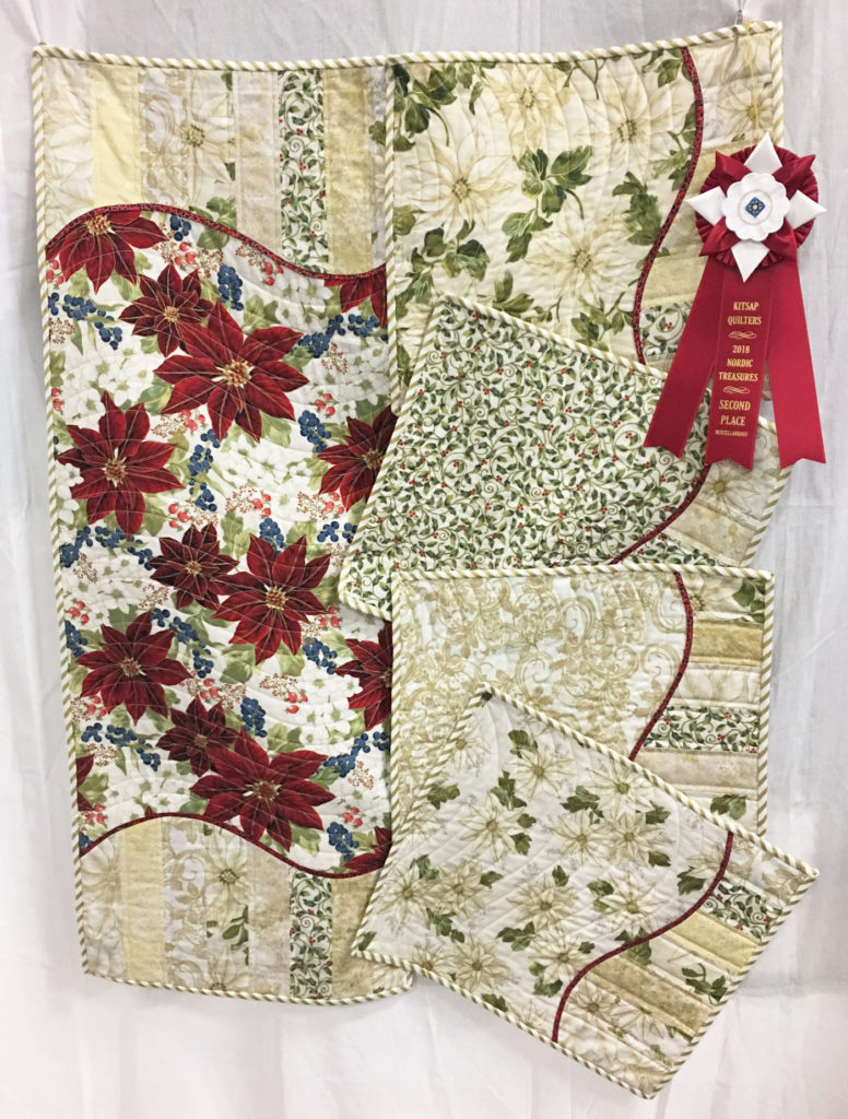 1004 “Celebrating Christmas Table Runner and Placemats” by Ann Trujillo, 2nd Place Miscellaneous Category, 2018 Kitsap Quilt Show