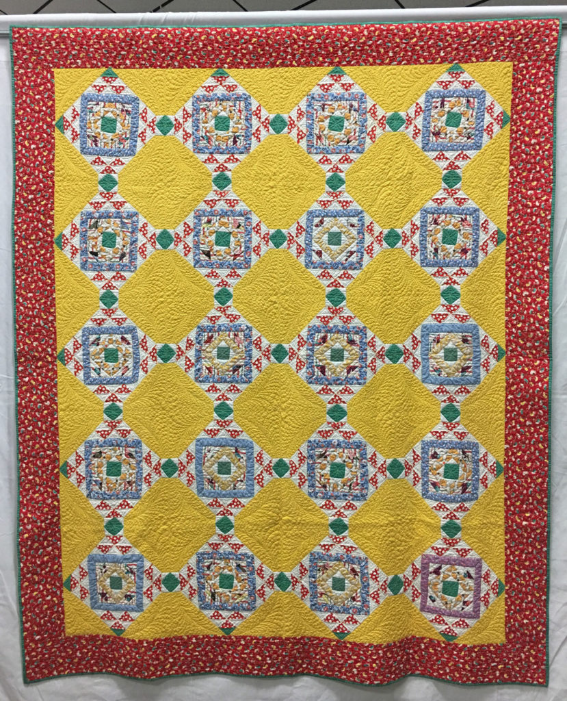411 “The Holey Polka Dot Rescue” by Unknown & Margaret Jones, quilted by White Lotus Quilting, HM Med/Lg Group Quilt, 2018 Kitsap Quilt Show